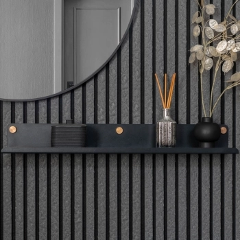 Warm beige acoustic panel styled with a brass shelf in a neutral roomset