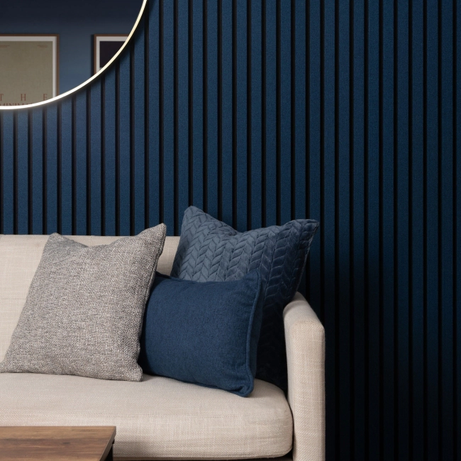 Living room accent wall drenched in denim blue panelling